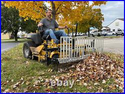 Swinging Tool Bar and Rake with tall Leaf Pushers mounts on a zero turn mower