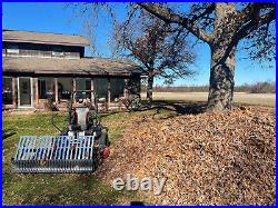 Swinging Tool Bar and Rake with tall Leaf Pushers mounts on a zero turn mower